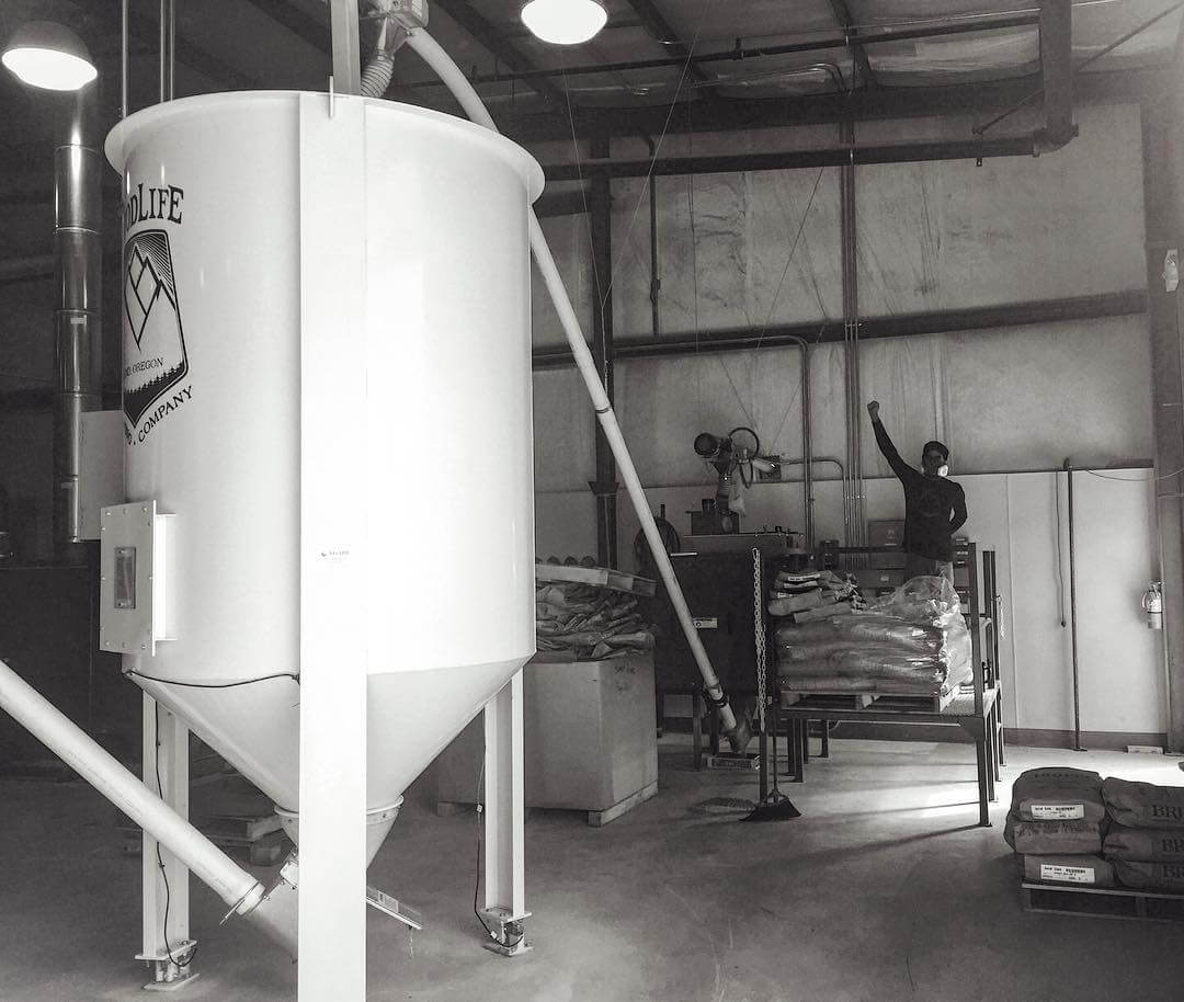 Victory! @nicosoulias doing his morning routine of crushing grain bags | #goodlifebrewing #bend #oregon #oregonbeer #brewery #grain #beerporn