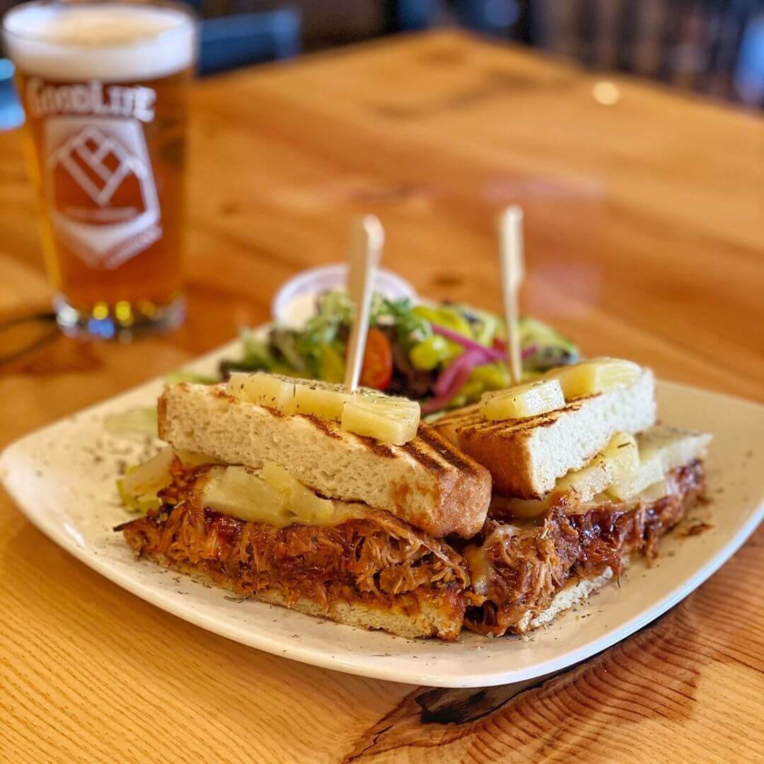 It’s Locals Day and here is the food special for the day! It’s a BBQ Pulled Pork Sandwich with pineapple, pickled red onions, havarti cheese and BBQ sauce! Pair that with a Mountain Rescue and that’s what we call the GoodLife!