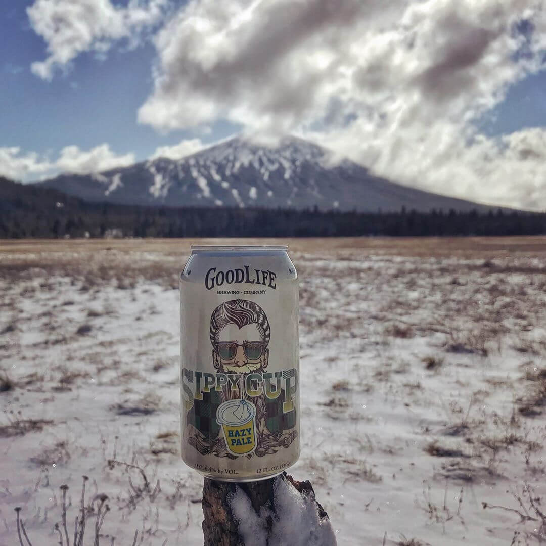 We’ve got a fresh new can and the mountain has a fresh new coat! #goodlifebrewing #sippycuphazypale